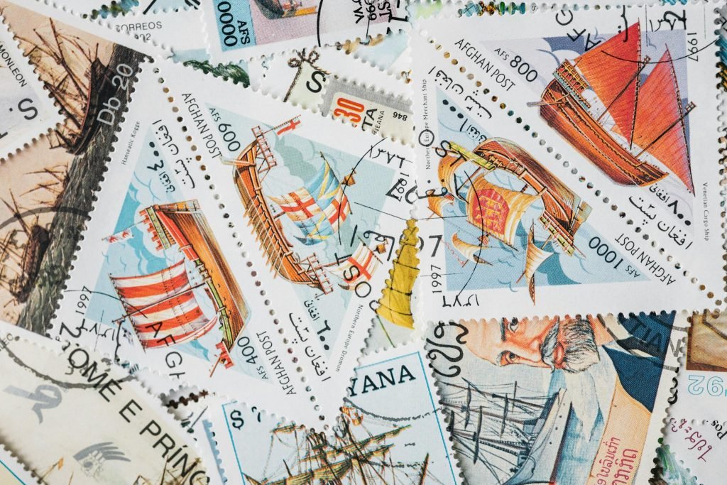 A vibrant assortment of vintage postage stamps featuring historical ships, perfect for collectors.